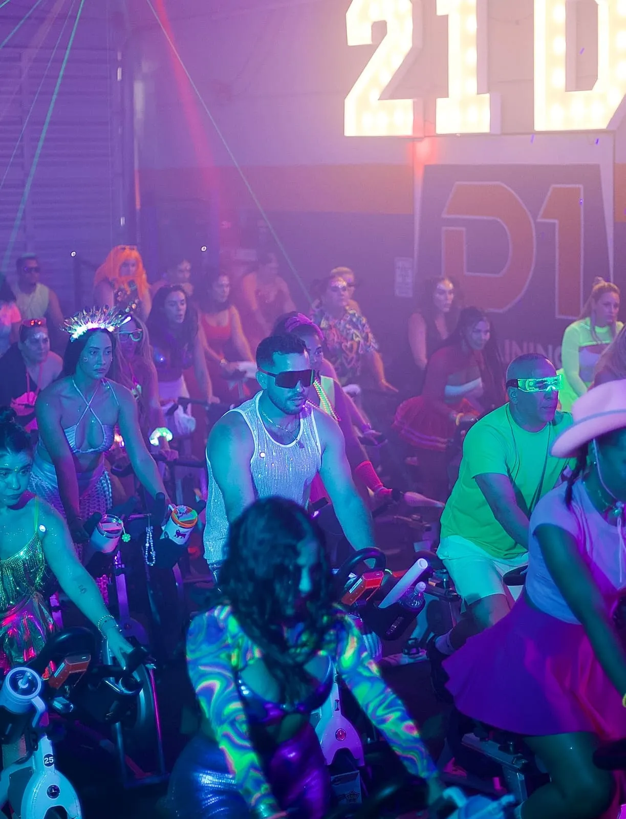 Riders mid-class at 21 DOSE spin studio in Medley