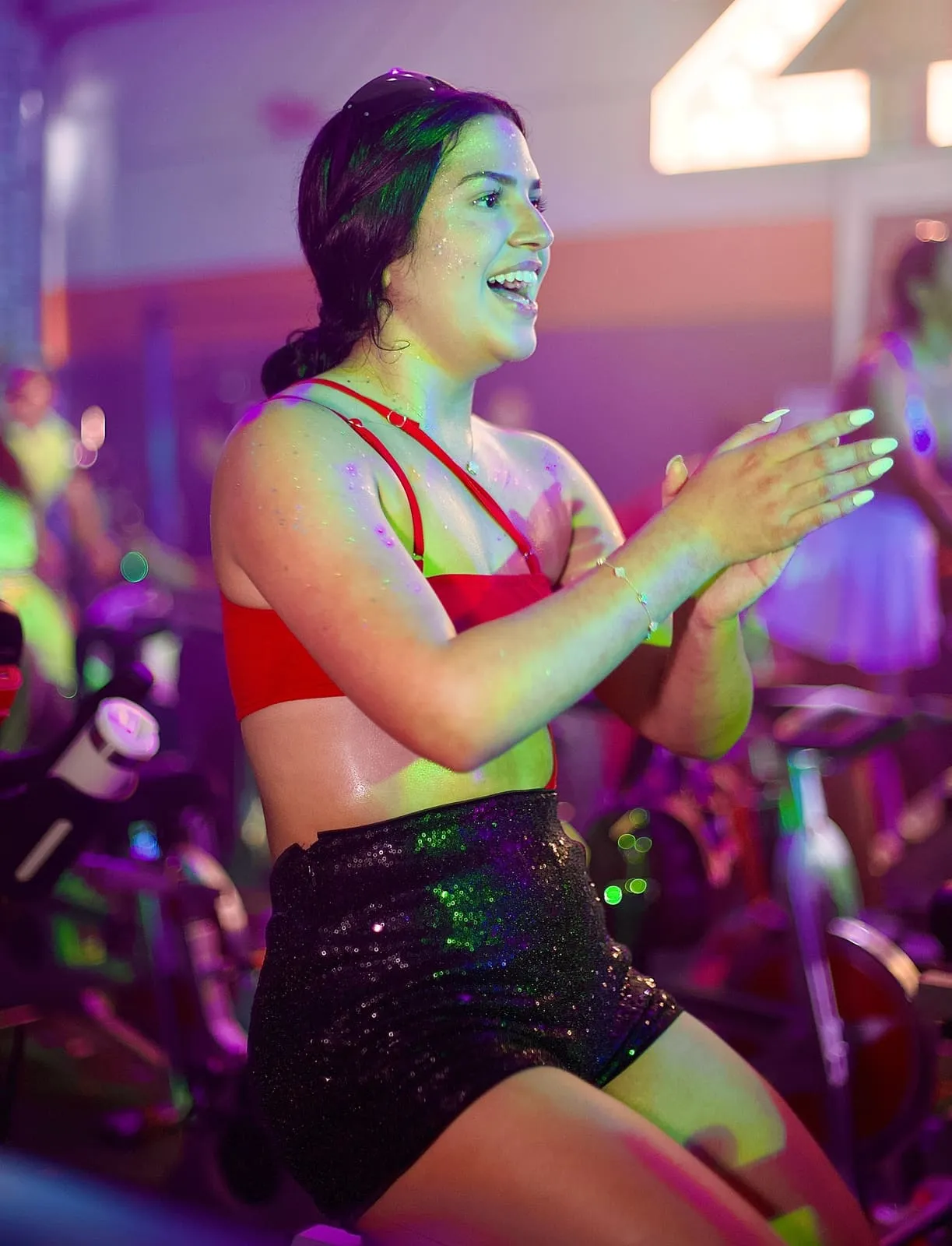 Rider sprinting on a spin bike at 21 DOSE